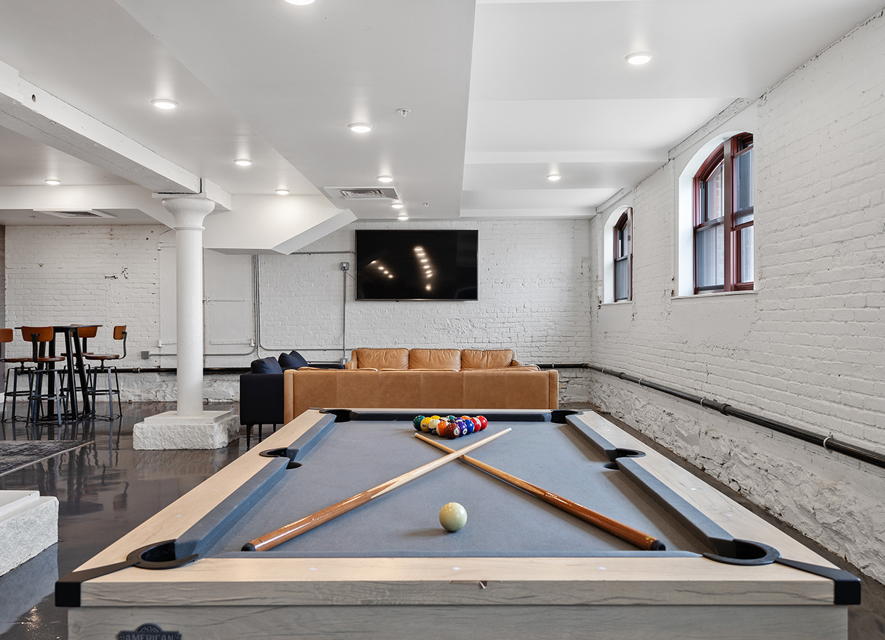 Photo of the pool table in the recreation room at 2 River Street.