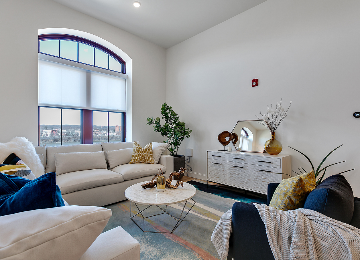 Photo of a furnished living room area in an apartment at 2 River Street.