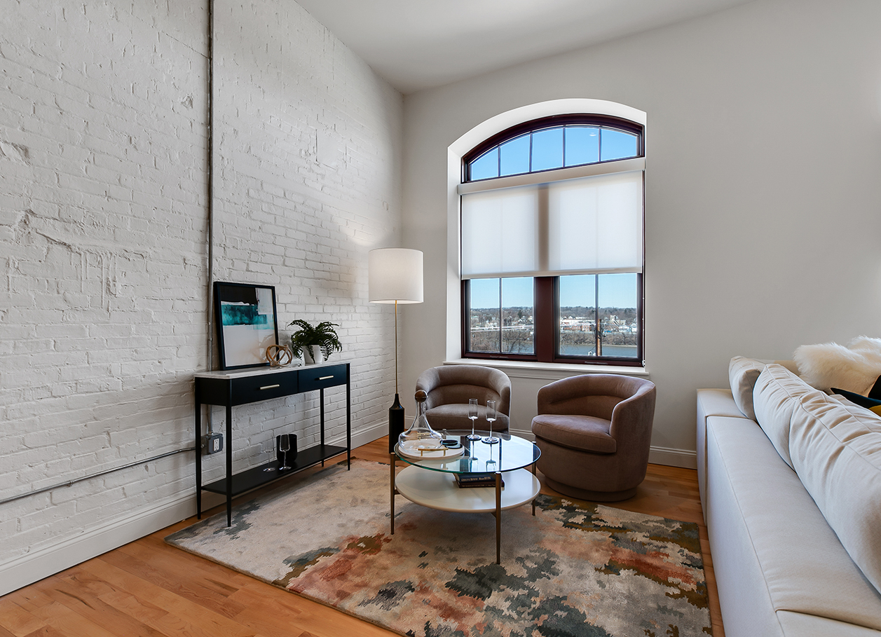 Photo of a furnished living room area from a different angle in an apartment at 2 River Street.