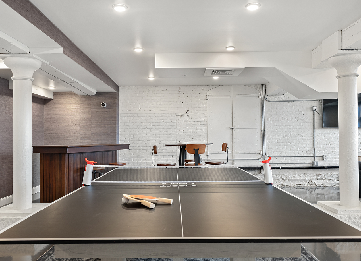 Photo of the ping pong table in the recreation room at 2 River Street.