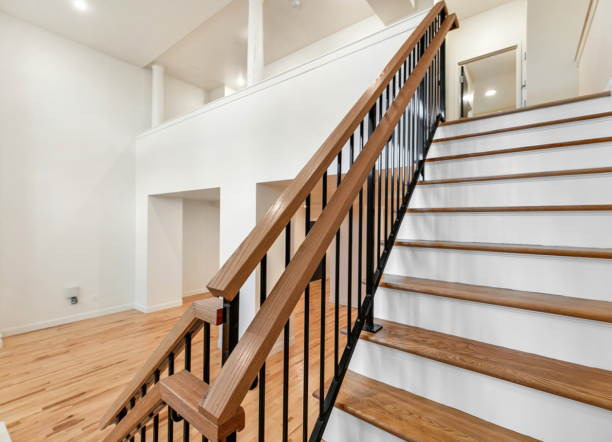 Photo looking up the stairs of a two floor apartment at 2 River Street.